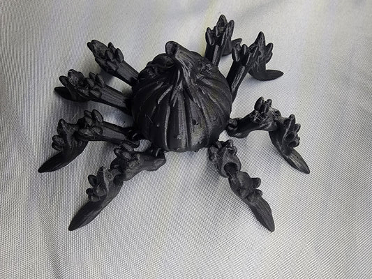 Pumpkin Spider articulating figurine is a great addition to your creepy Halloween decor and fun to play with