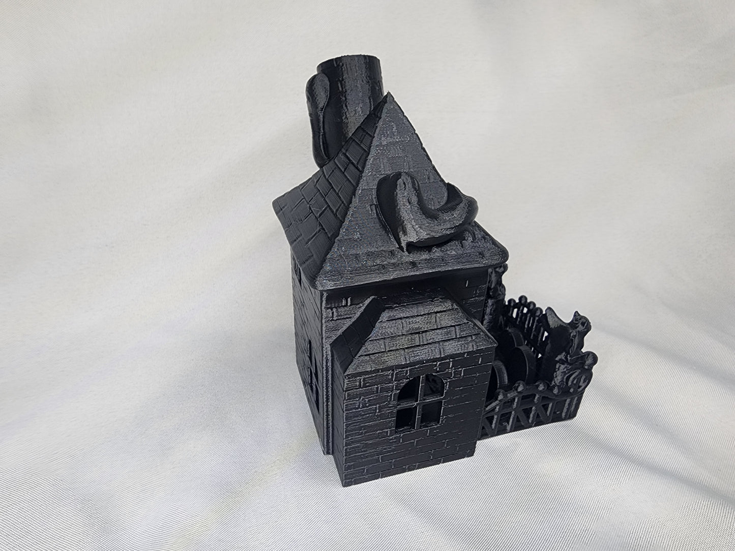 Haunted House Dice Tower is the perfect decoration and dice game accessory for Halloween or year-round.