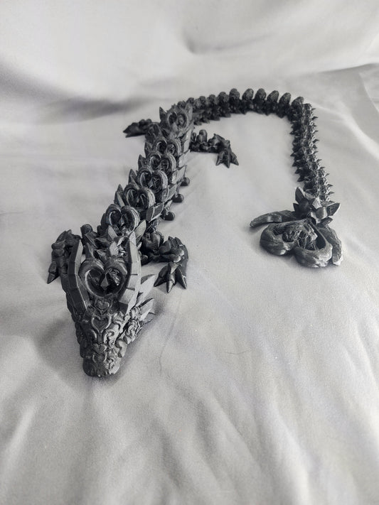 Dark Heart Dragon articulating figurine with a spinning heart tail