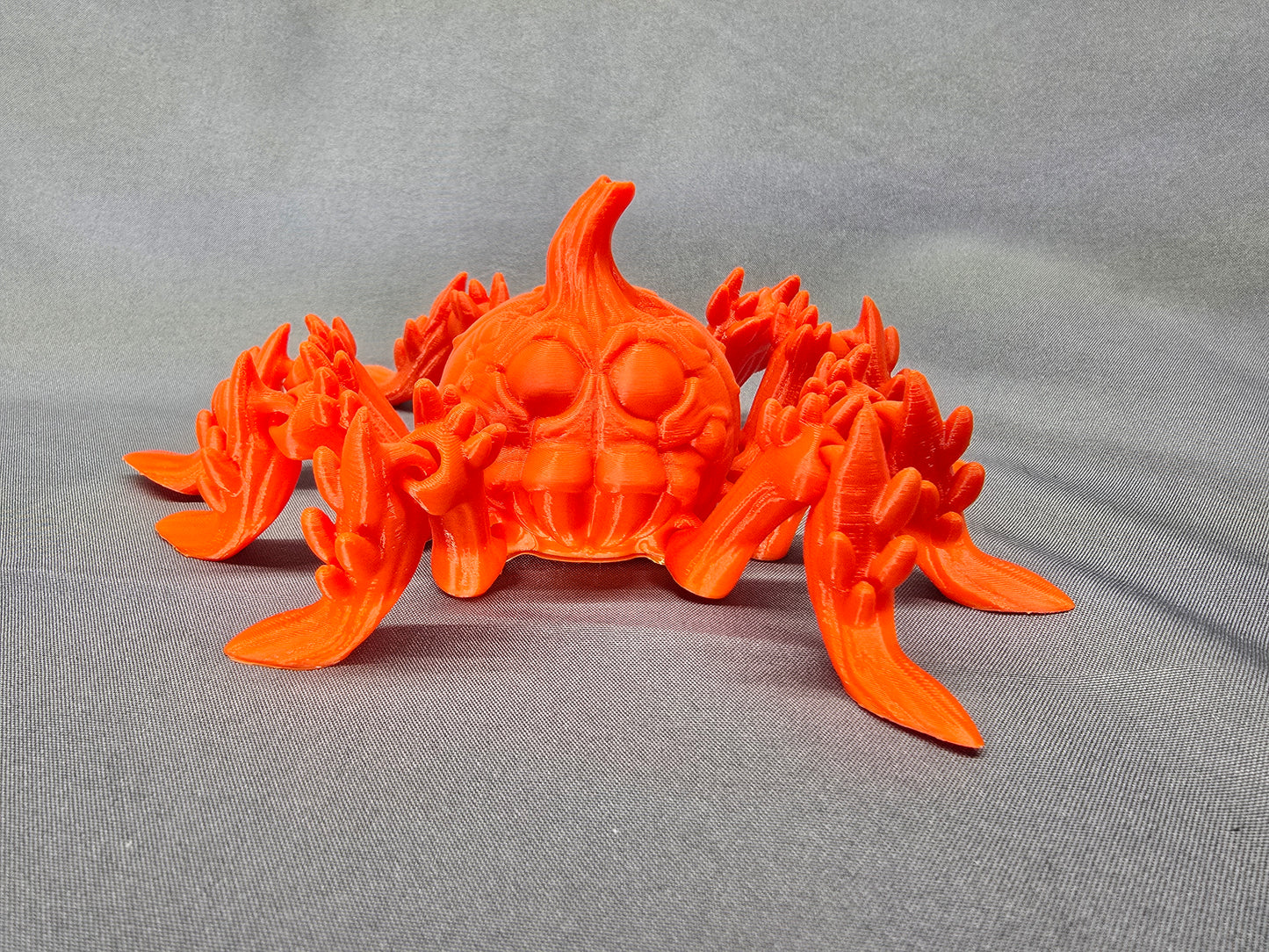 Pumpkin Spider articulating figurine is a great addition to your creepy Halloween decor and fun to play with