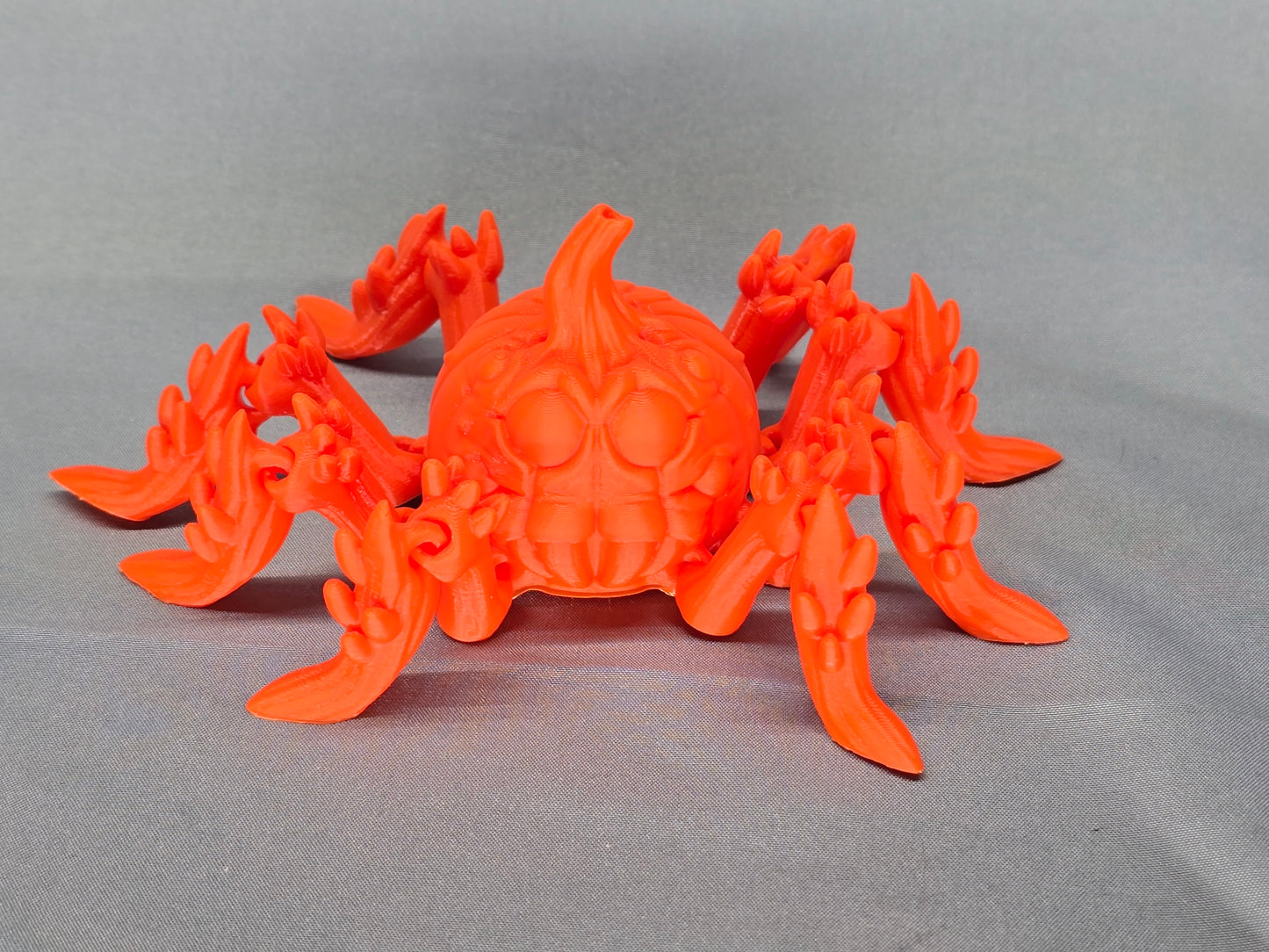 Pumpkin Spider articulating figurine is a great addition to your creepy Halloween decor and fun to play with