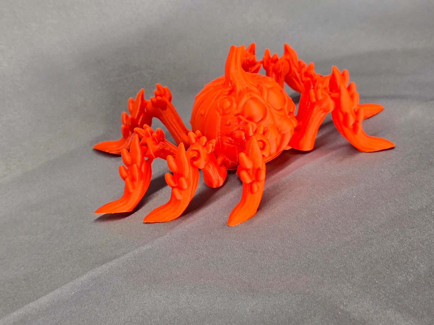 Pumpkin Spider articulating figurine is a great addition to your creepy Halloween decor and fun to play with