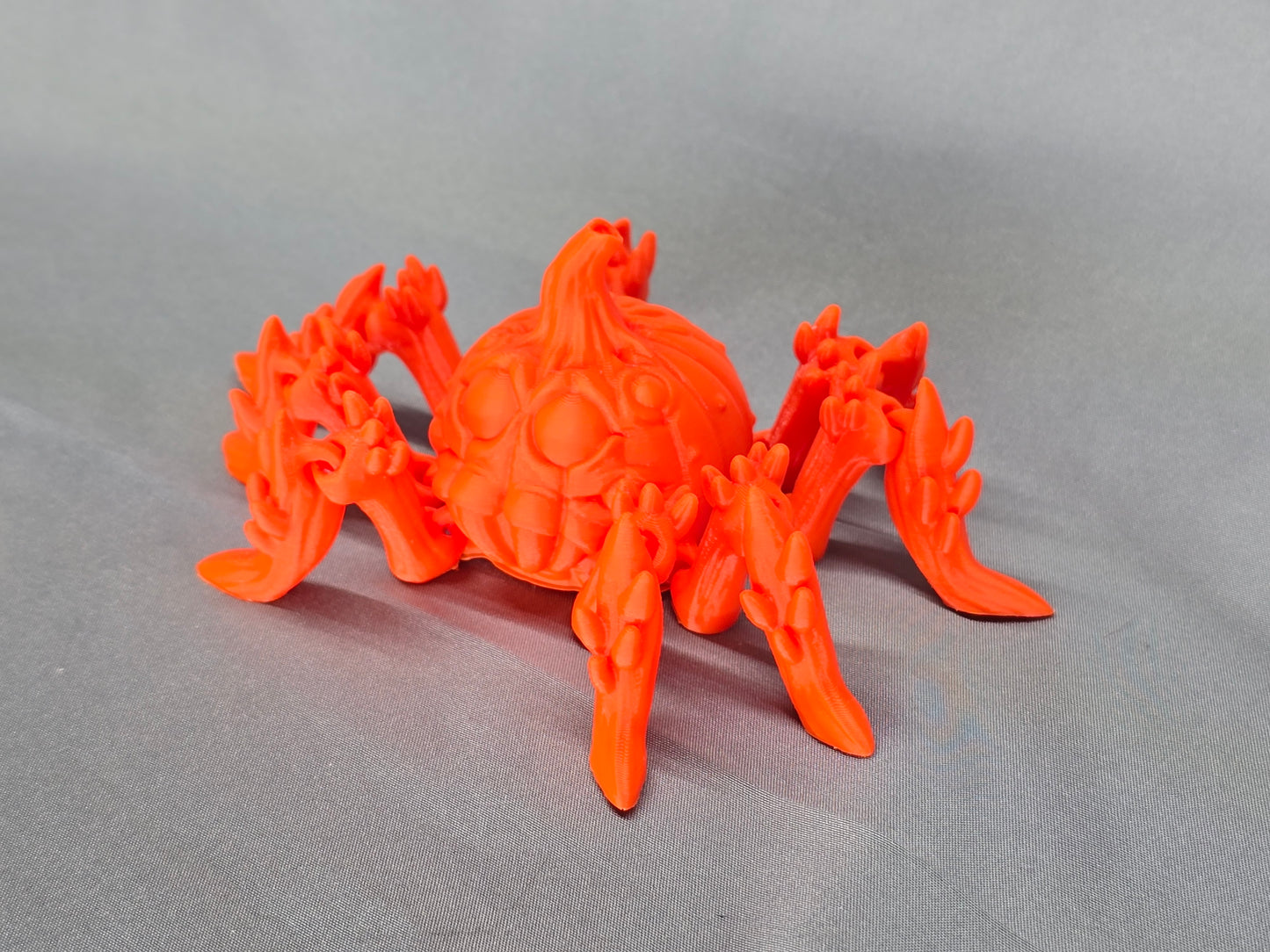Pumpkin Spider articulating figurine is a great addition to your creepy Halloween decor and fun to play with