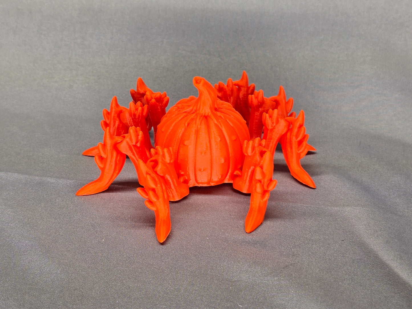 Pumpkin Spider articulating figurine is a great addition to your creepy Halloween decor and fun to play with