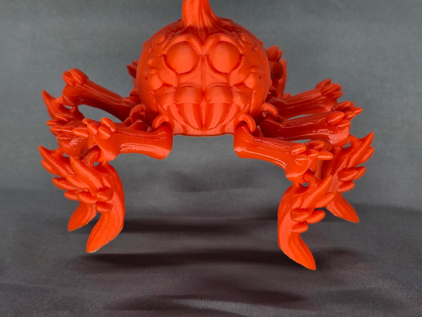 Pumpkin Spider articulating figurine is a great addition to your creepy Halloween decor and fun to play with