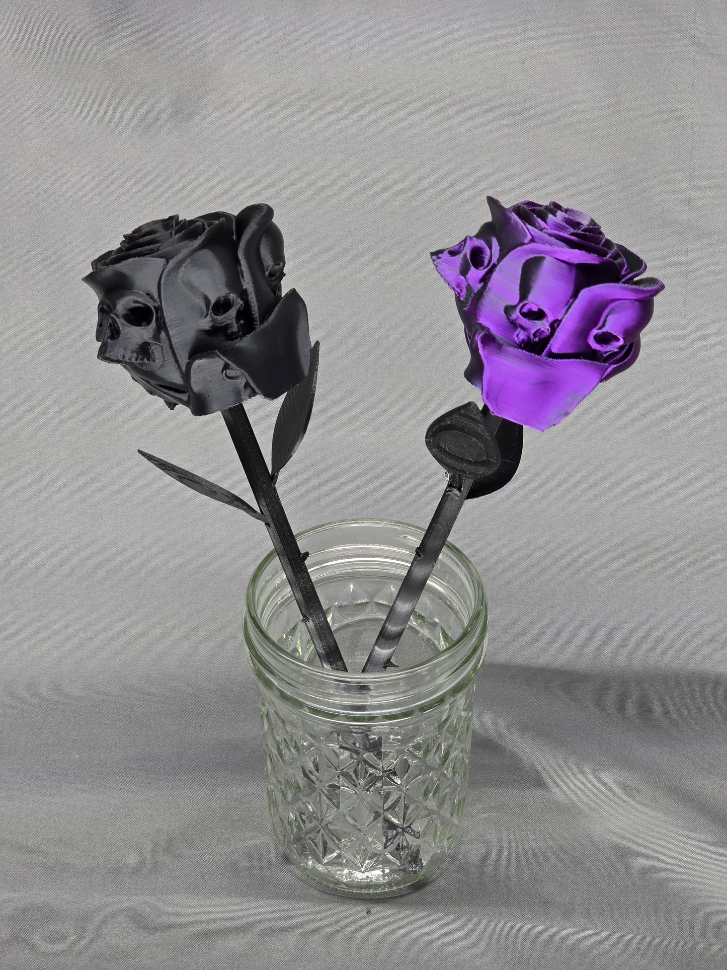 The Forbidden Rose decoration featuring a rose with thorns, 2 leafs and petals with skulls