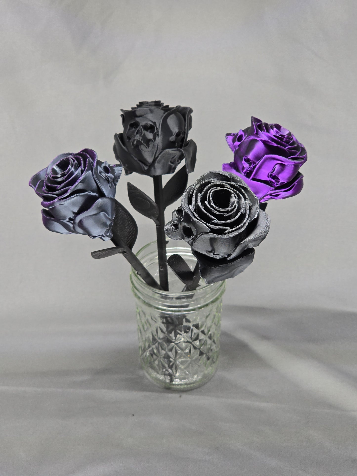 The Forbidden Rose decoration featuring a rose with thorns, 2 leafs and petals with skulls