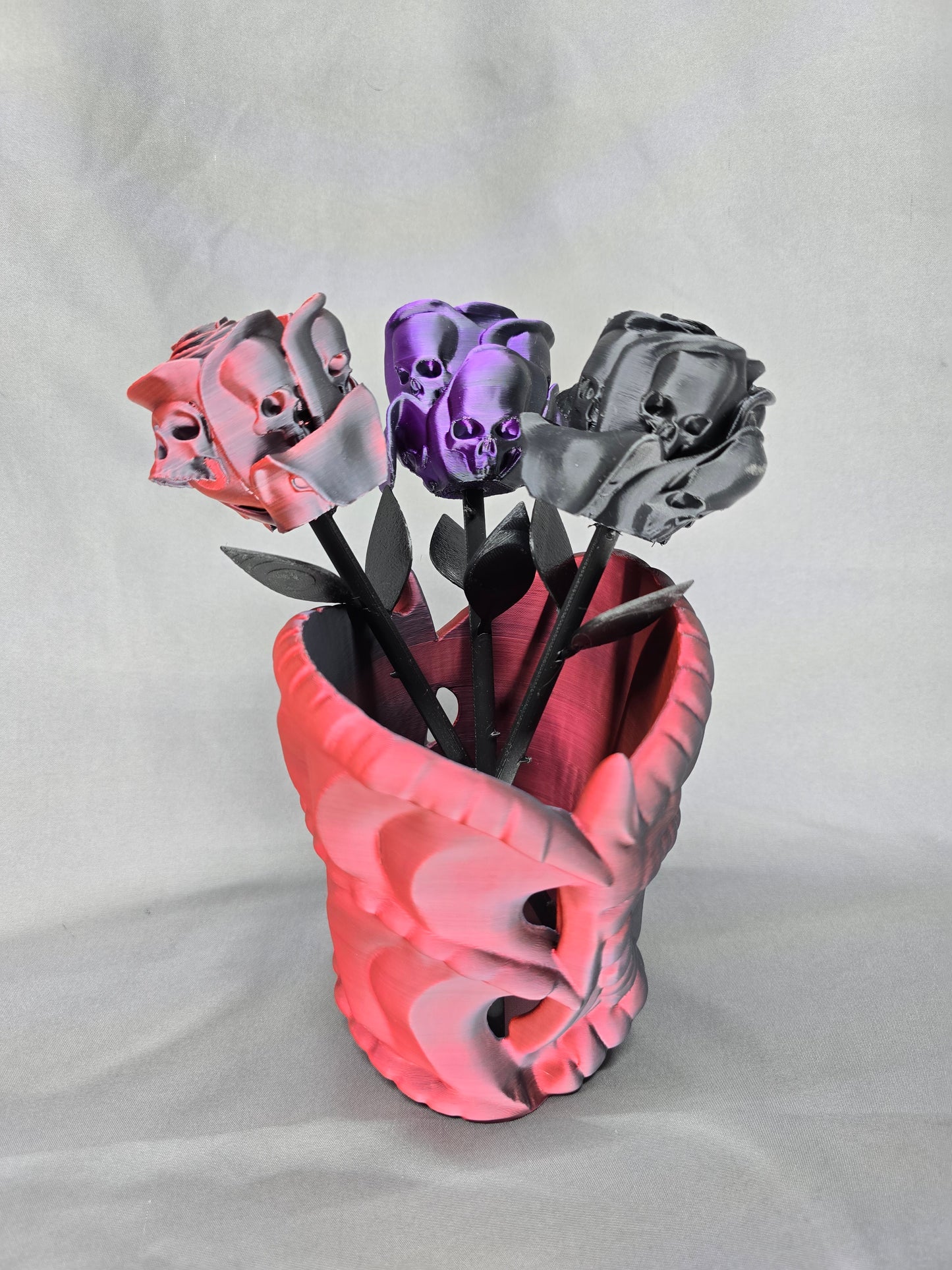 The Forbidden Rose decoration featuring a rose with thorns, 2 leafs and petals with skulls