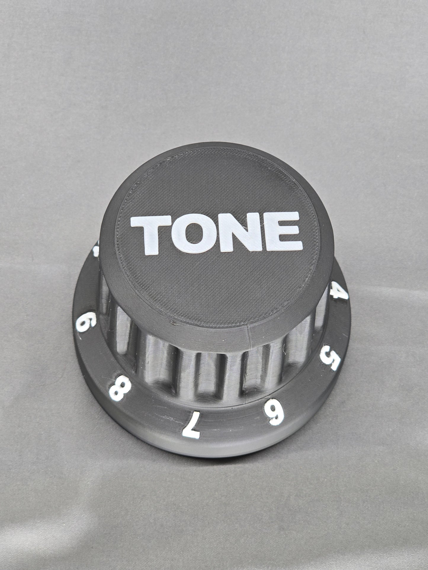 Tone Knob container is the perfect gift that holds everything from guitar picks to 9v batteries for your pedal