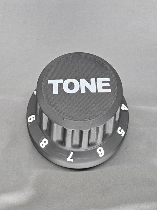 Tone Knob container is the perfect gift that holds everything from guitar picks to 9v batteries for your pedal