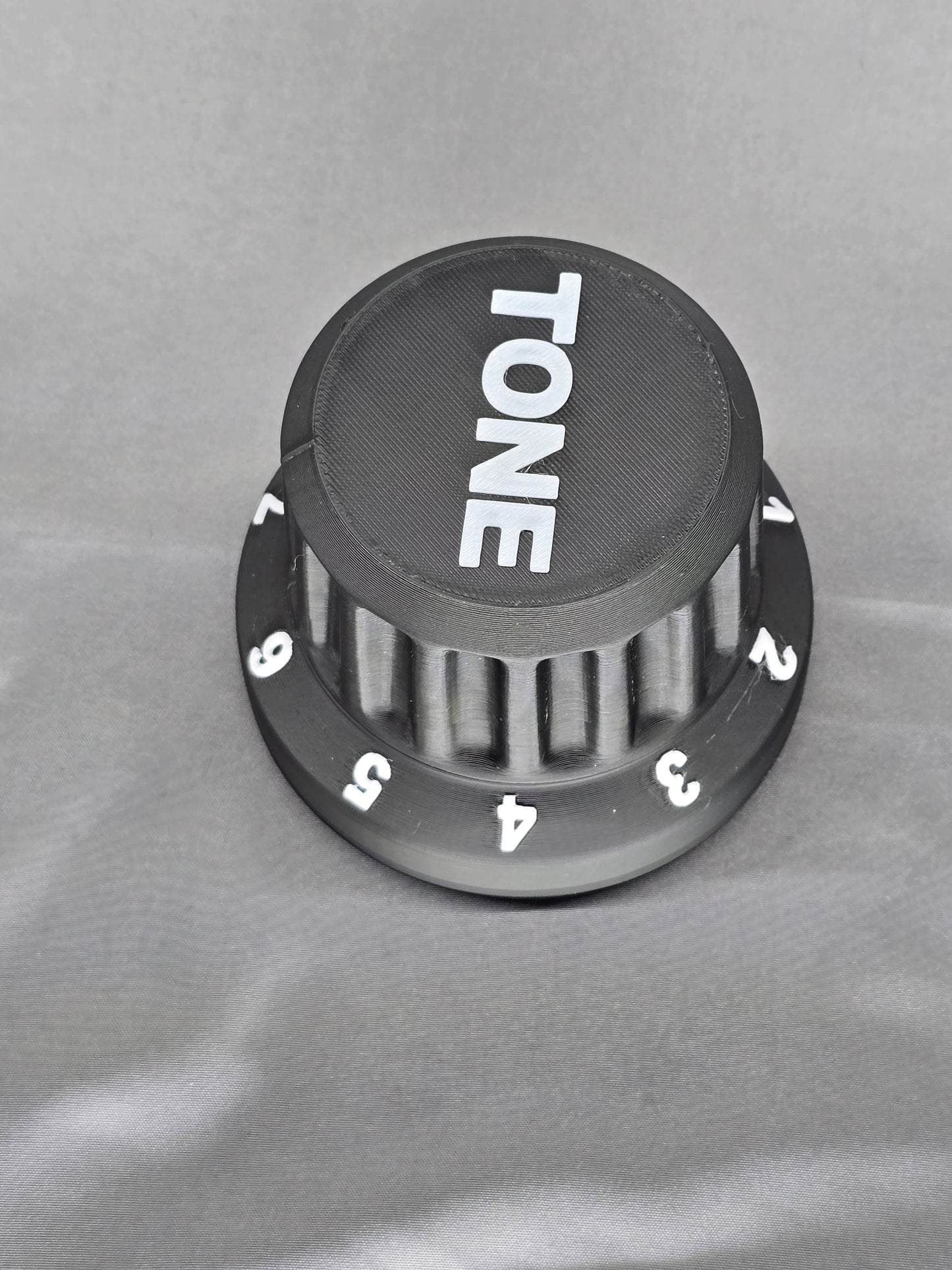 Tone Knob container is the perfect gift that holds everything from guitar picks to 9v batteries for your pedal