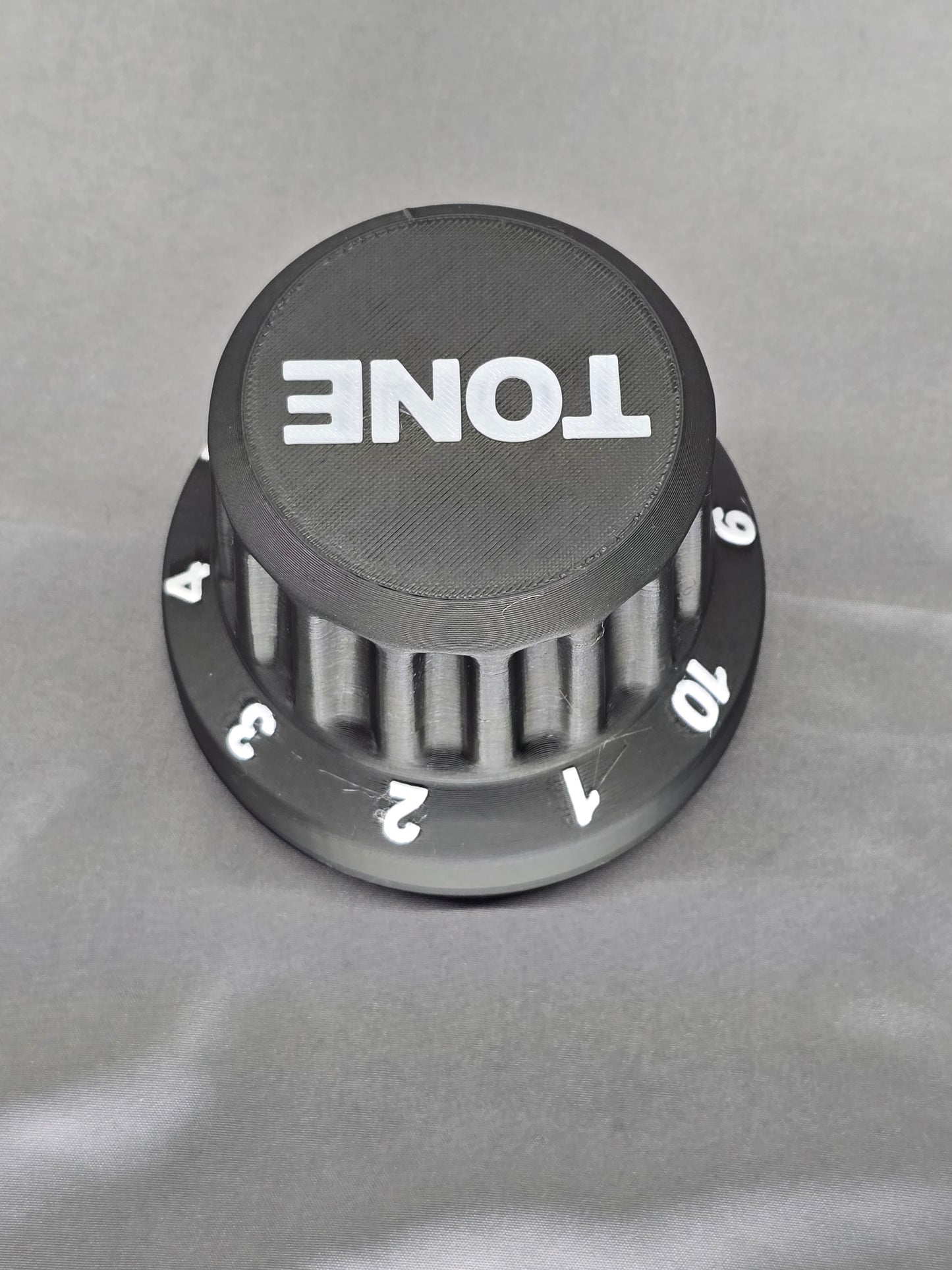 Tone Knob container is the perfect gift that holds everything from guitar picks to 9v batteries for your pedal