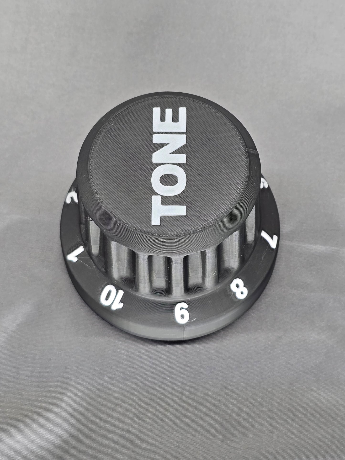 Tone Knob container is the perfect gift that holds everything from guitar picks to 9v batteries for your pedal