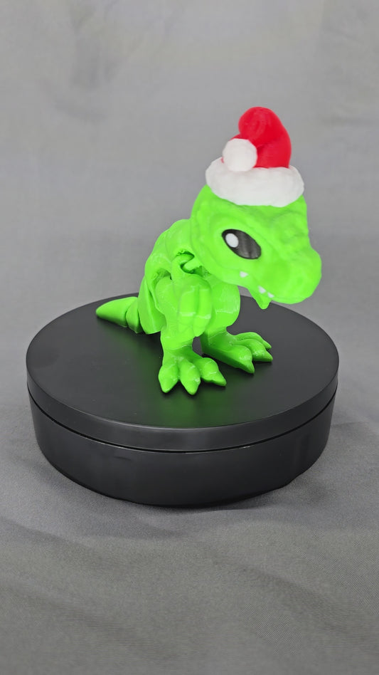 Tiny T-Rex Santa articulating figurine decoration will bring a lot of joy with a lot of teeth!
