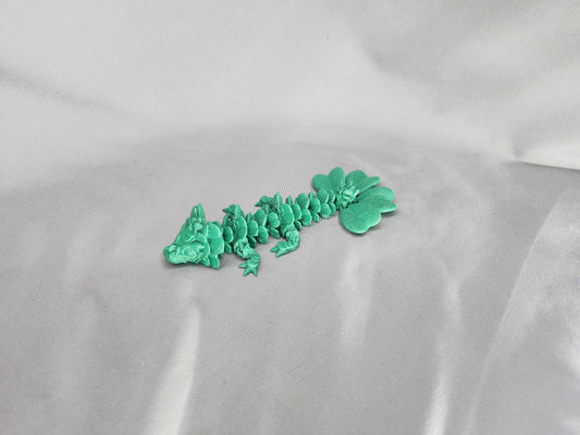 4 Leaf Clover Dragon Baby articulating figurine will surely bring some luck to your decor