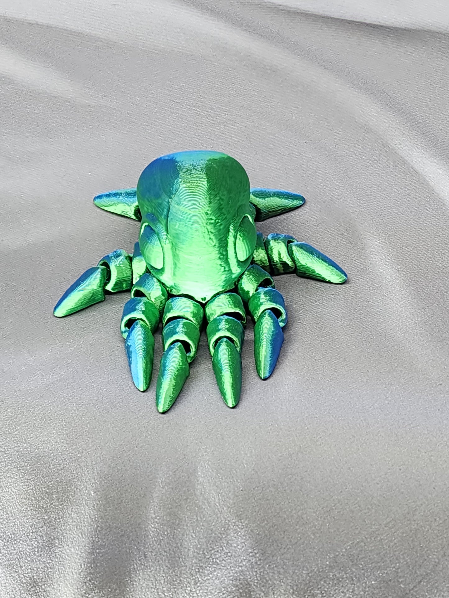 Tiny Octopus articulating figurine blue green tentacles 