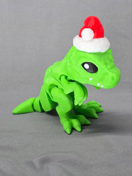 Tiny T-Rex Santa articulating figurine decoration will bring a lot of joy with a lot of teeth!