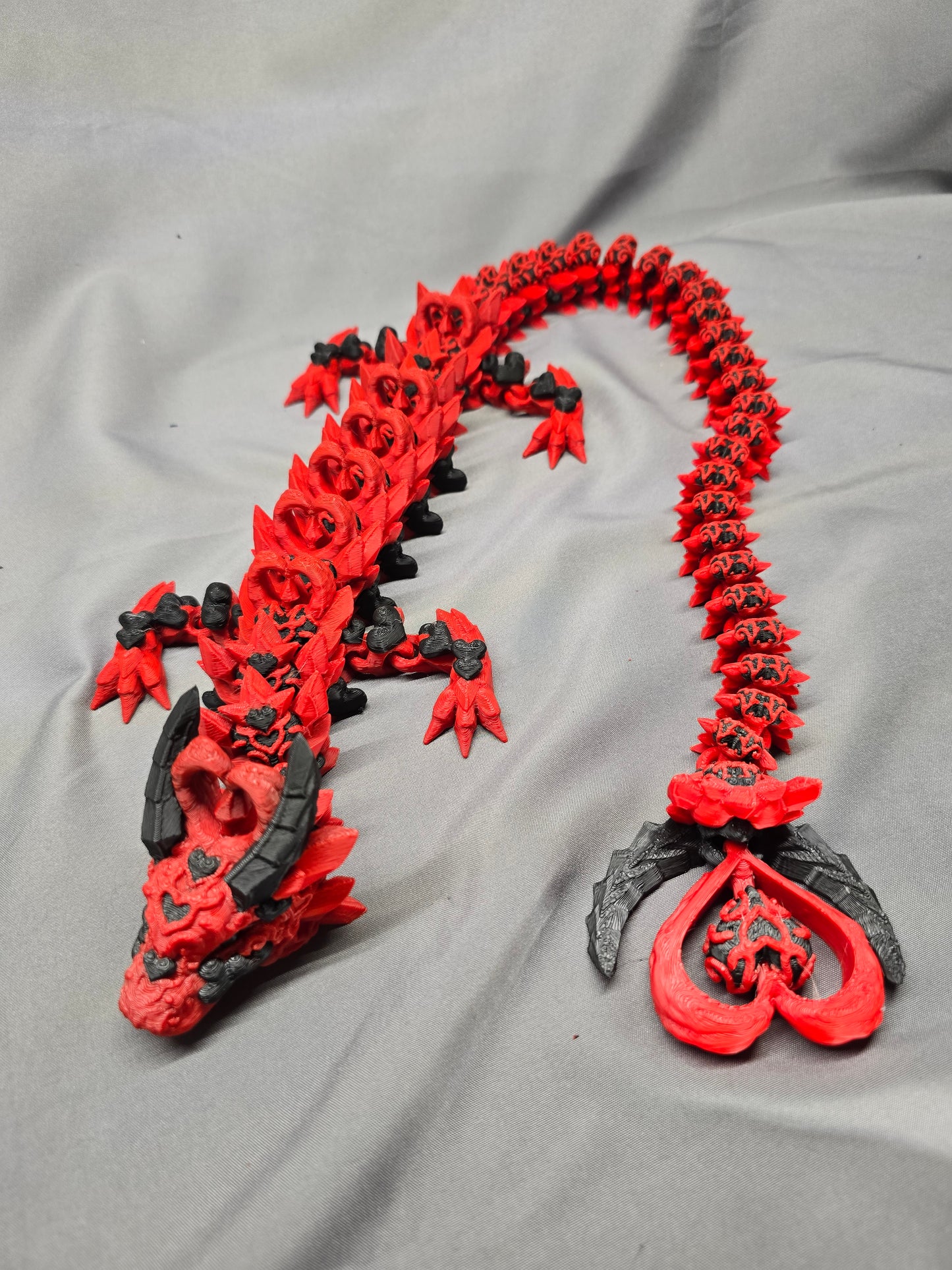Dark Heart Dragon articulating figurine with a spinning heart tail