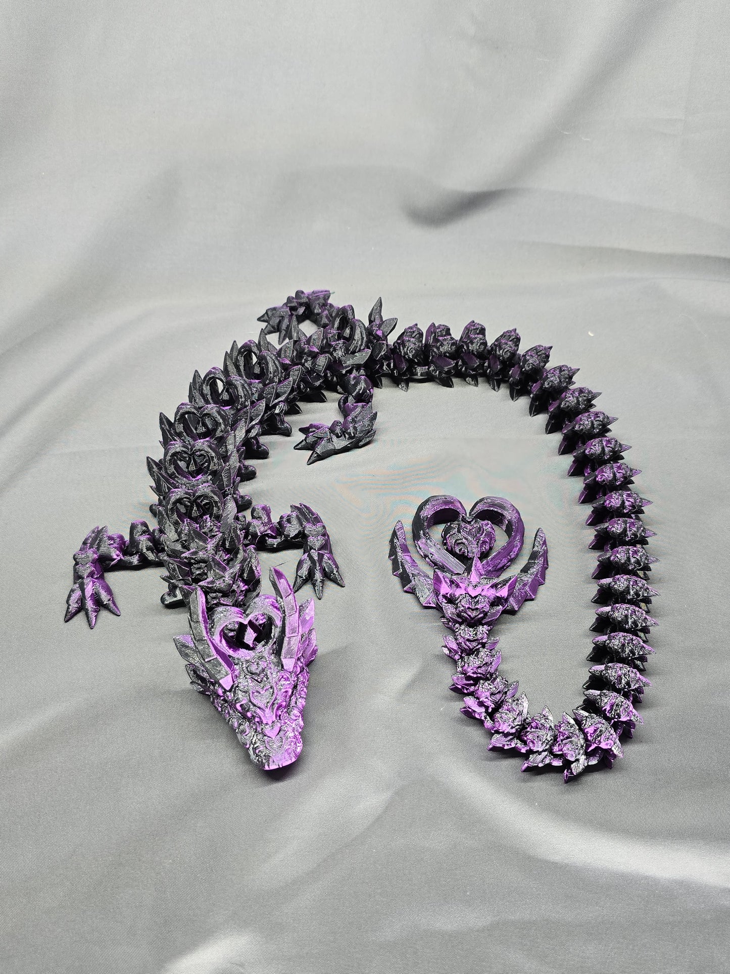 Dark Heart Dragon articulating figurine with a spinning heart tail