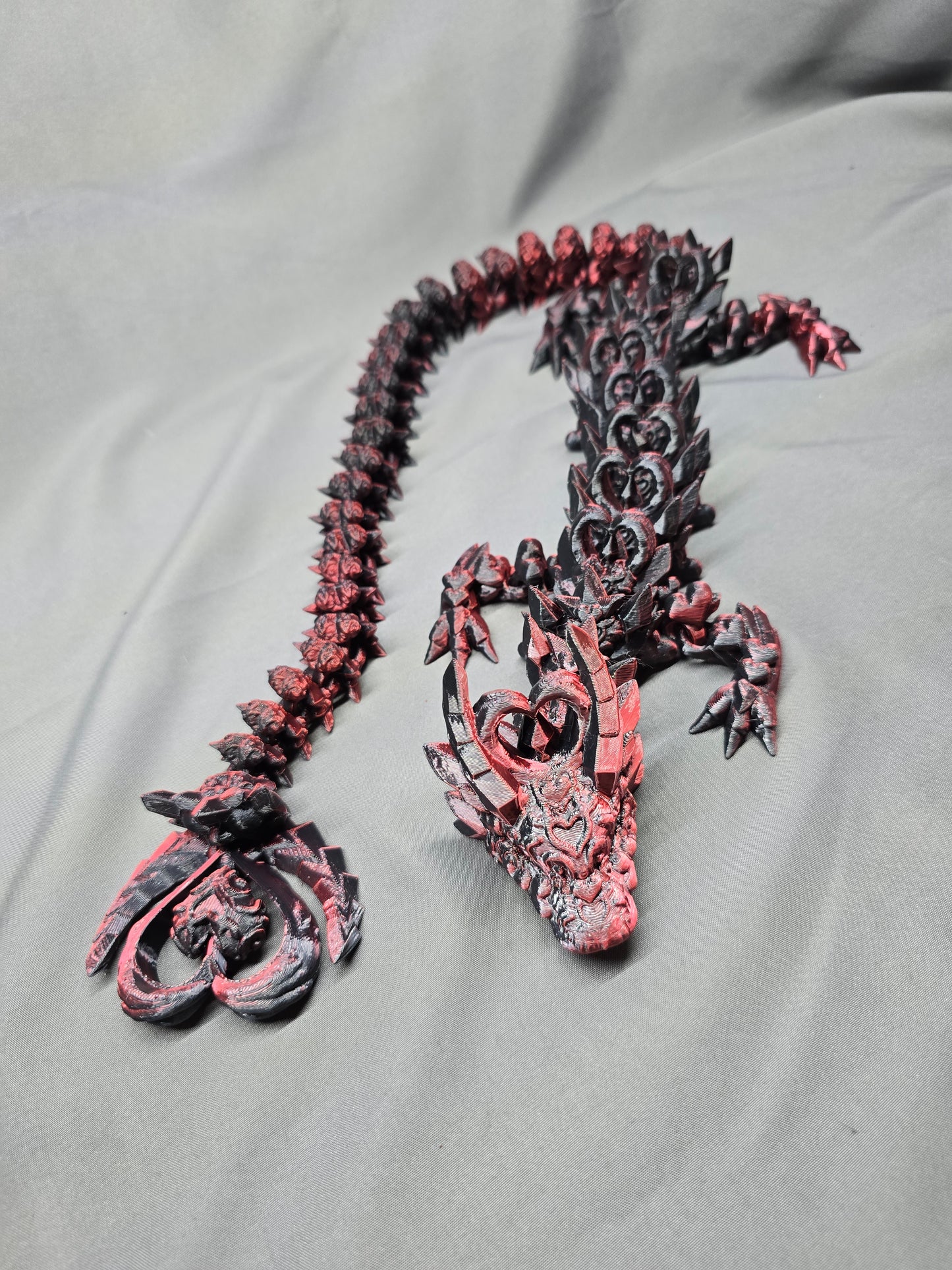 Dark Heart Dragon articulating figurine with a spinning heart tail