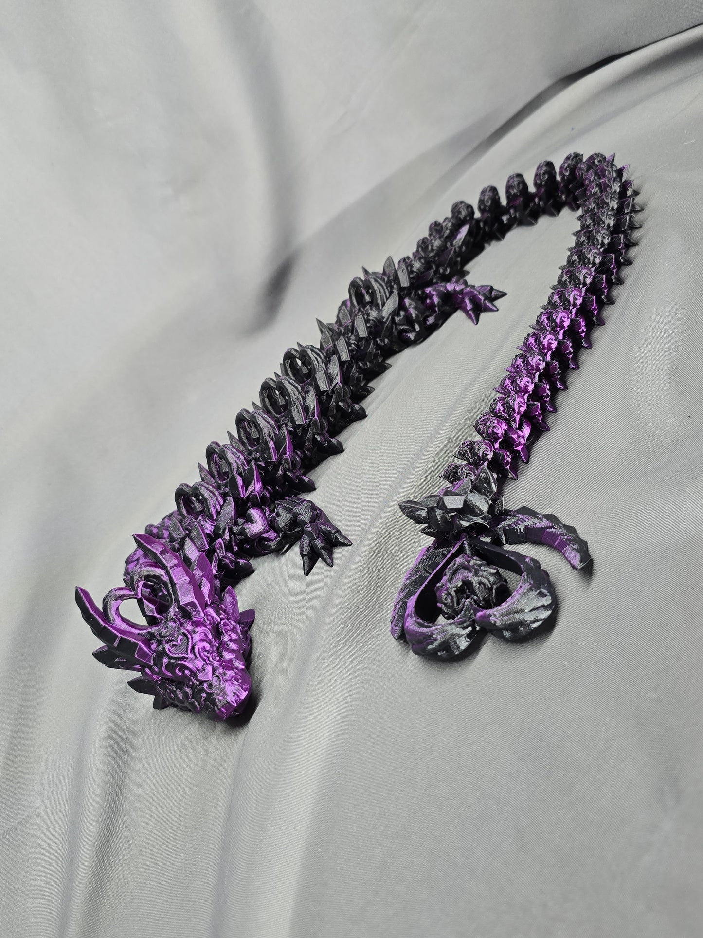 Dark Heart Dragon articulating figurine with a spinning heart tail