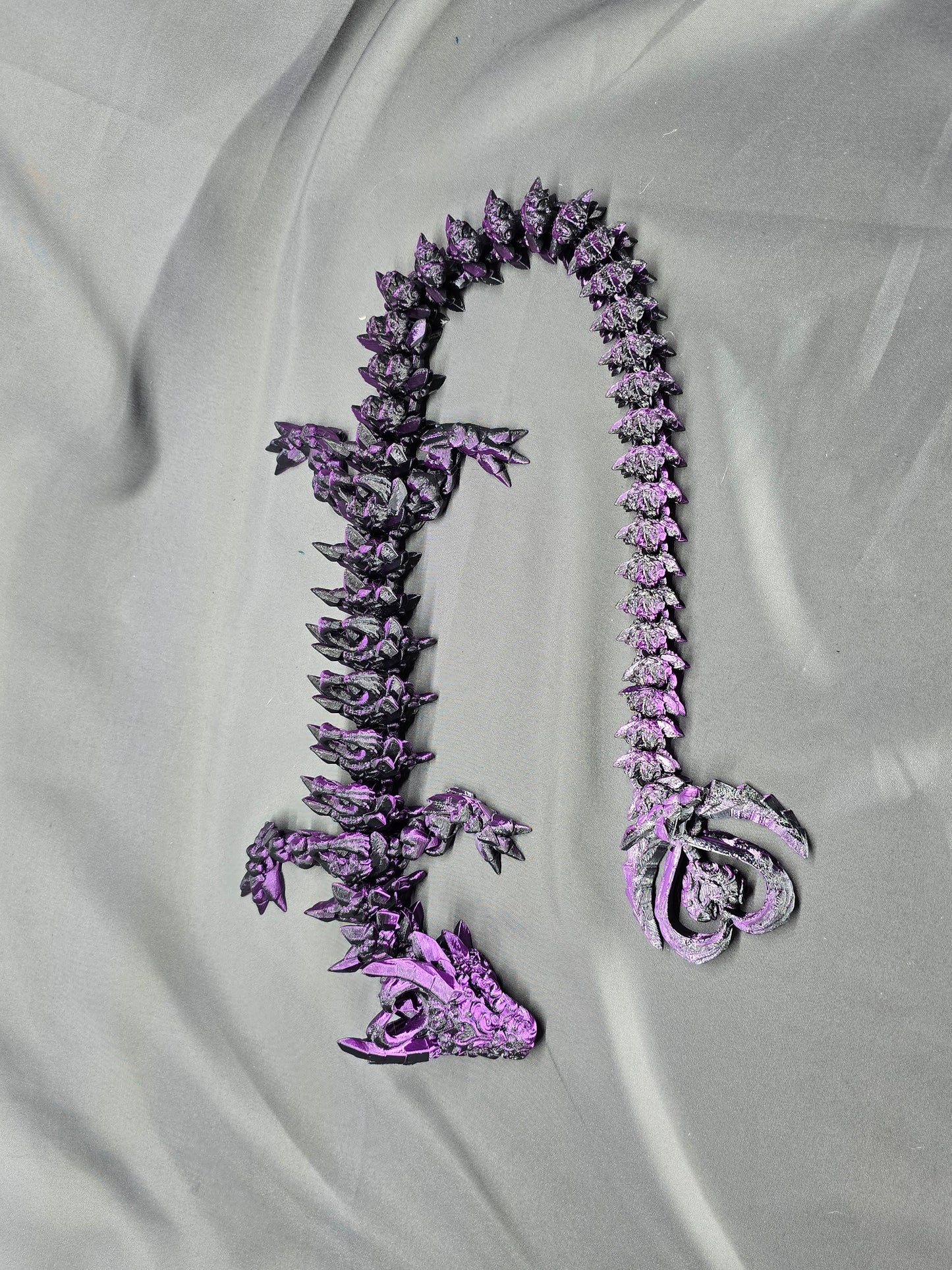 Dark Heart Dragon articulating figurine with a spinning heart tail